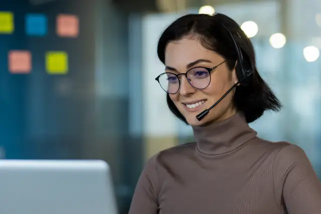 smiling young woman working with a headset 2026 03 24 21 49 59 utc Medium
